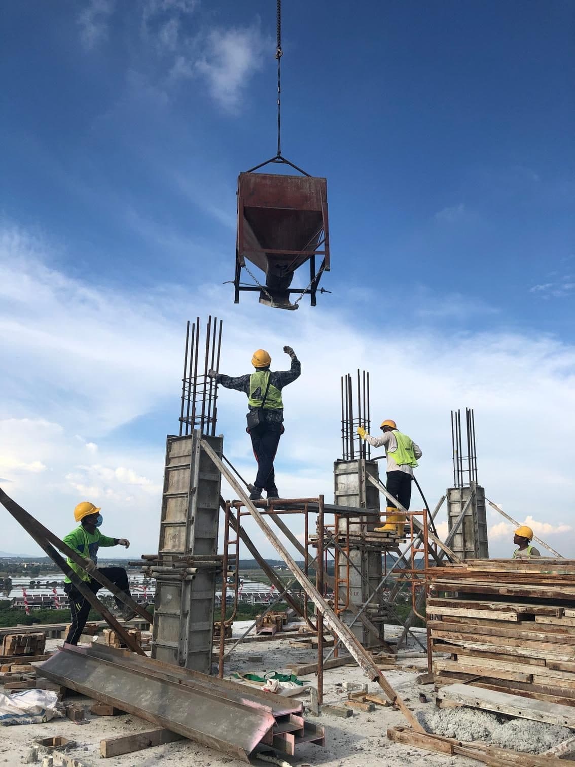 Shahab Builders crew placing rebar and formwork on an active construction site